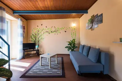a living room with a couch and a table at The Normans Apartments in Palermo