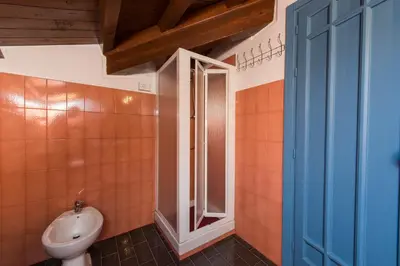a bathroom with a toilet and a sink in it at The Normans Apartments in Palermo