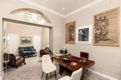 a living room with a table and chairs at I Mori di Porta Nuova Suite & Terrace in Palermo