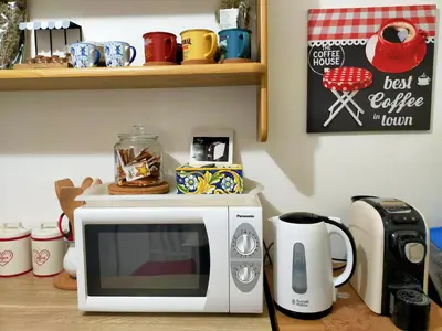 a microwave sitting on top of a counter at Le terrazze segrete in Palermo