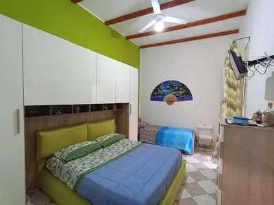 a bedroom with a bed and a tv in it at Casa 