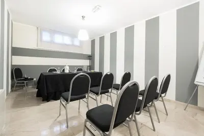 a meeting room with a table and chairs at Hotel Garibaldi in Palermo