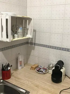 a kitchen counter top with a sink and a counter top at Tiny House Basilio in Palermo