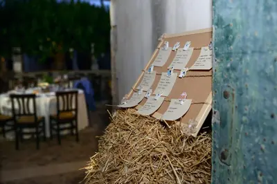 a restaurant with a table and chairs and a swimming pool at Fattoria Manostalla Villa Chiarelli in Balestrate