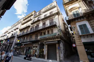 a group of buildings on a city street at GuestHost - Quattro Canti Charming Flat in Palermo