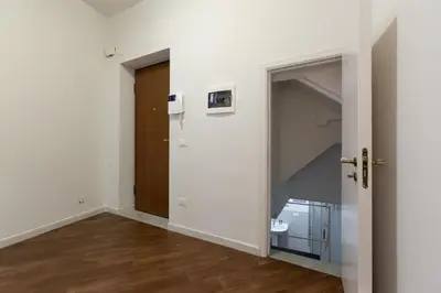 an empty room with an open door and a closet at GuestHost - Quattro Canti Charming Flat in Palermo