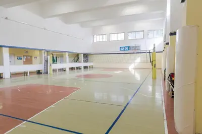 an empty gymnasium with a basketball court in a building at Casa per Ferie Don Orione Palermo in Palermo