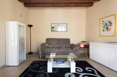 a living room with a couch and a table at Santa Cecilia Apartment by Wonderful Italy in Palermo