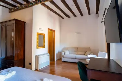 a living room with a couch and a table at Villa Vittoria Hotel in Alcamo