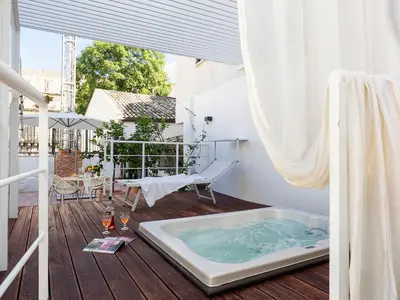 a jacuzzi tub on the deck of a house at Il Giardino di Ballarò Boutique B&B in Palermo