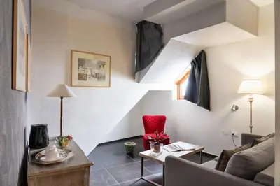 a living room with a couch and a table at Il Giardino di Ballarò Boutique B&B in Palermo