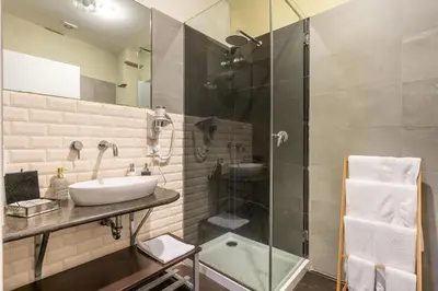 a bathroom with a sink and a shower at Il Giardino di Ballarò Boutique B&B in Palermo