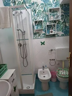 a small bathroom with a shower and a toilet at Loft CASA PROFESSA 1 in Palermo