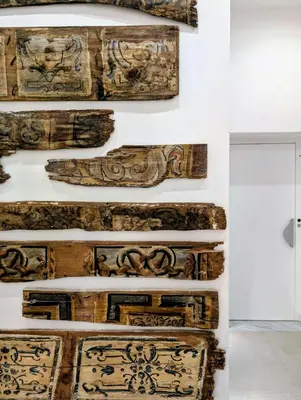 a wall of wood carving on a wall in a museum at Porta di Castro Hotel & SPA in Palermo