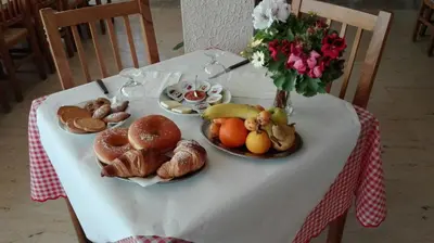 a plate with a piece of food and a cup of coffee at MillePini in Calatafimi