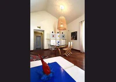 a living room with a couch and a table at Casa Santa Sofia in Palermo