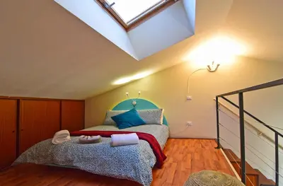 a bedroom with a bed and a skylight at Casa Santa Sofia in Palermo