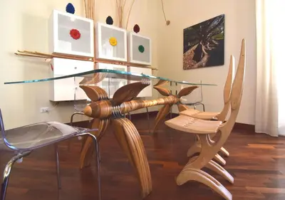 a glass table and chairs in a room at Casa Santa Sofia in Palermo