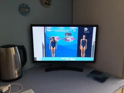 a computer monitor sitting on top of a desk at Short Lets Vacanze 