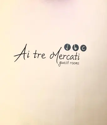 an at the merrett guest rooms logo on a wall at Ai Tre Mercati in Palermo
