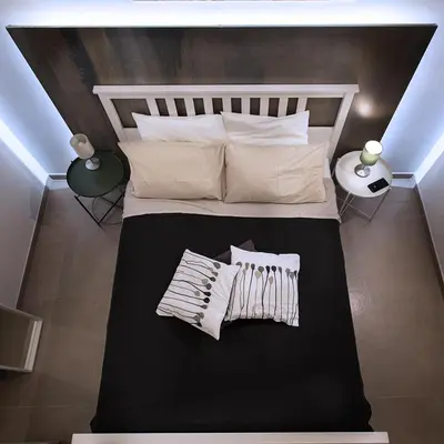 a bedroom with a bed with white pillows at SpAsimoH-2 in Palermo