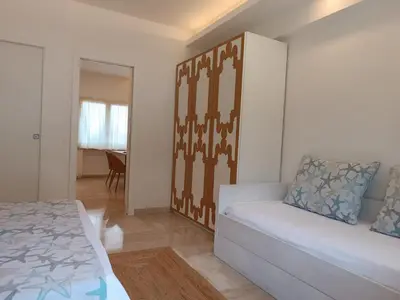 a living room with a bed and a couch at La Marsa Vacances in Mondello