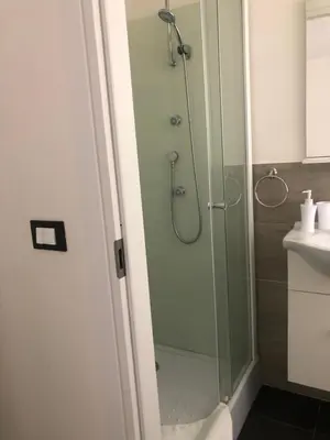 a shower with a glass door in a bathroom at Dolce Vita casa vacanze in Carini