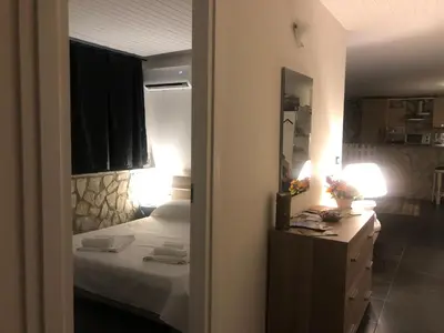 a bedroom with a bed and a dresser and a mirror at Dolce Vita casa vacanze in Carini