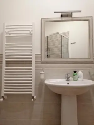 a bathroom with a sink and a mirror at Casagioiosa18 in Palermo