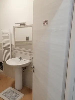 a bathroom with a sink and a mirror at Casagioiosa18 in Palermo