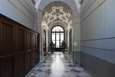 a hallway in a building with a large window at casa mo room and suite in Palermo