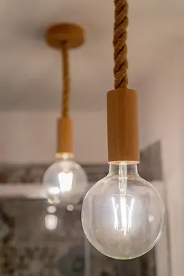 a glass light bulb with a rope attached to it at A casa di Antonietta in Palermo
