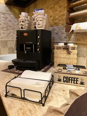 a coffee maker sitting on top of a counter at La casetta del vicoletto in Palermo