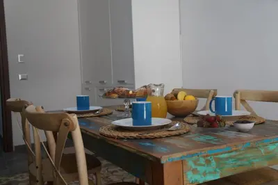 a wooden table with food on top of it at Finisterre in San Vito lo Capo