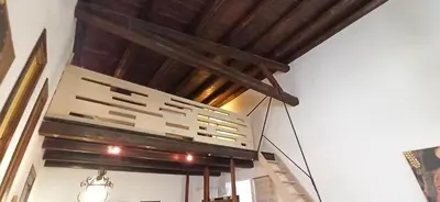 a chandelier hanging from a ceiling in a room at Palermo Holiday Studio in Palermo