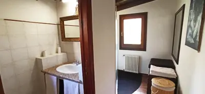 a bathroom with a sink and a mirror at Palermo Holiday Studio in Palermo