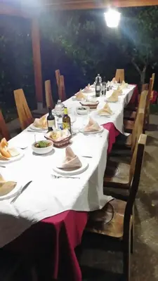 a long table with plates of food on it at Villa Giardino Paradiso Cefalù con 13 posti letto e piscina riscaldata in Cefalù