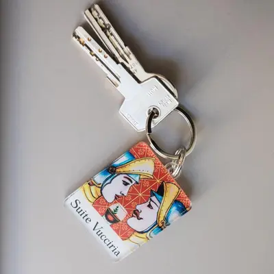 a keychain with a picture of two people on it at Dietro la Cattedrale in Palermo