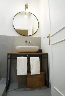 a bathroom with a sink and a mirror at T-home / Stylish apartment Palermo center in Palermo