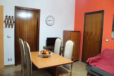 a dining room with a table with a bowl of fruit on it at Da Angelo in Castellammare del Golfo