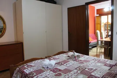 a bedroom with a bed with towels on it at Da Angelo in Castellammare del Golfo