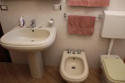 a bathroom with a sink and a toilet at Da Angelo in Castellammare del Golfo