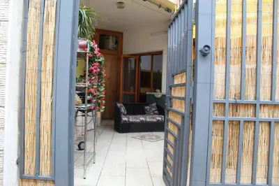 a view through a blue door into a living room at Da Angelo in Castellammare del Golfo