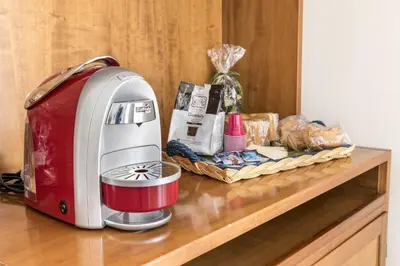 a toaster sitting on top of a counter with food at Apartments Bed Abate in Villabate