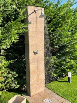 a water fountain in the middle of a garden at Ziba Villa Siciliana con piscina e vista panoramica sul mare in Borgetto