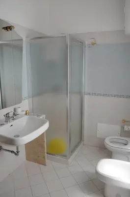 a bathroom with a shower and a sink and a toilet at Katia appartamenti in San Vito lo Capo