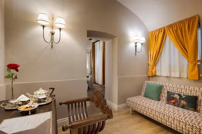 a living room with a couch and a table at Palazzo Arone dei Baroni di Valentino in Palermo