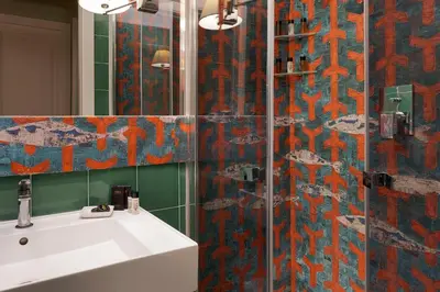 a bathroom with a shower with a sink and a mirror at Palazzo Arone dei Baroni di Valentino in Palermo