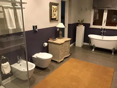 a bathroom with a tub and a toilet and a sink at B&B Le Biciclette in San Vito lo Capo