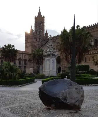a large building with a large rock in front of it at Cavour Il Conte Camillo in Palermo